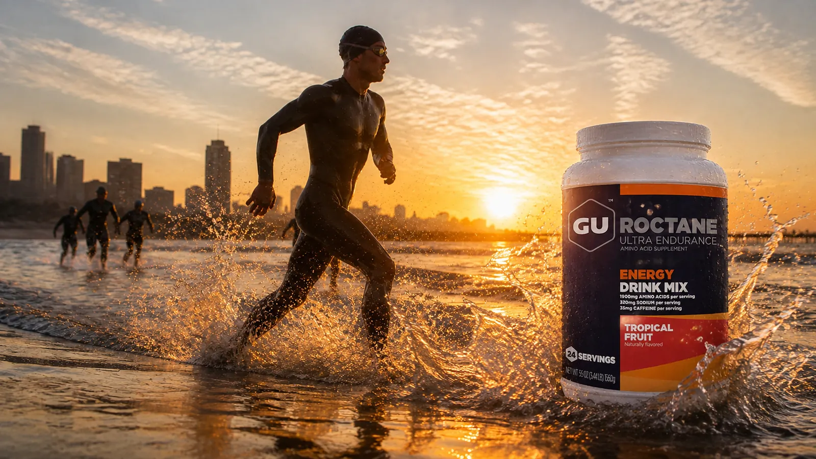 Triathletes running out of the surf at sunrise in Durban